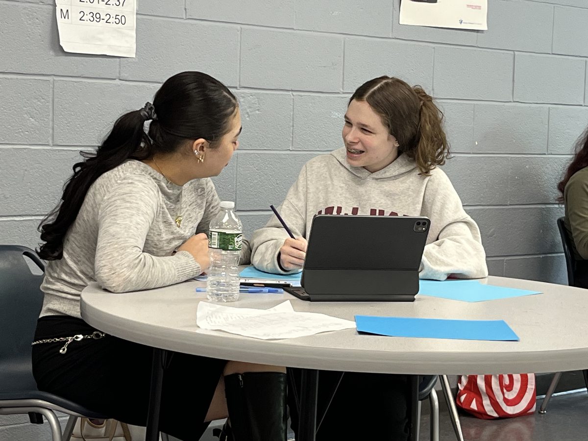 Two WHHS students working together at a table