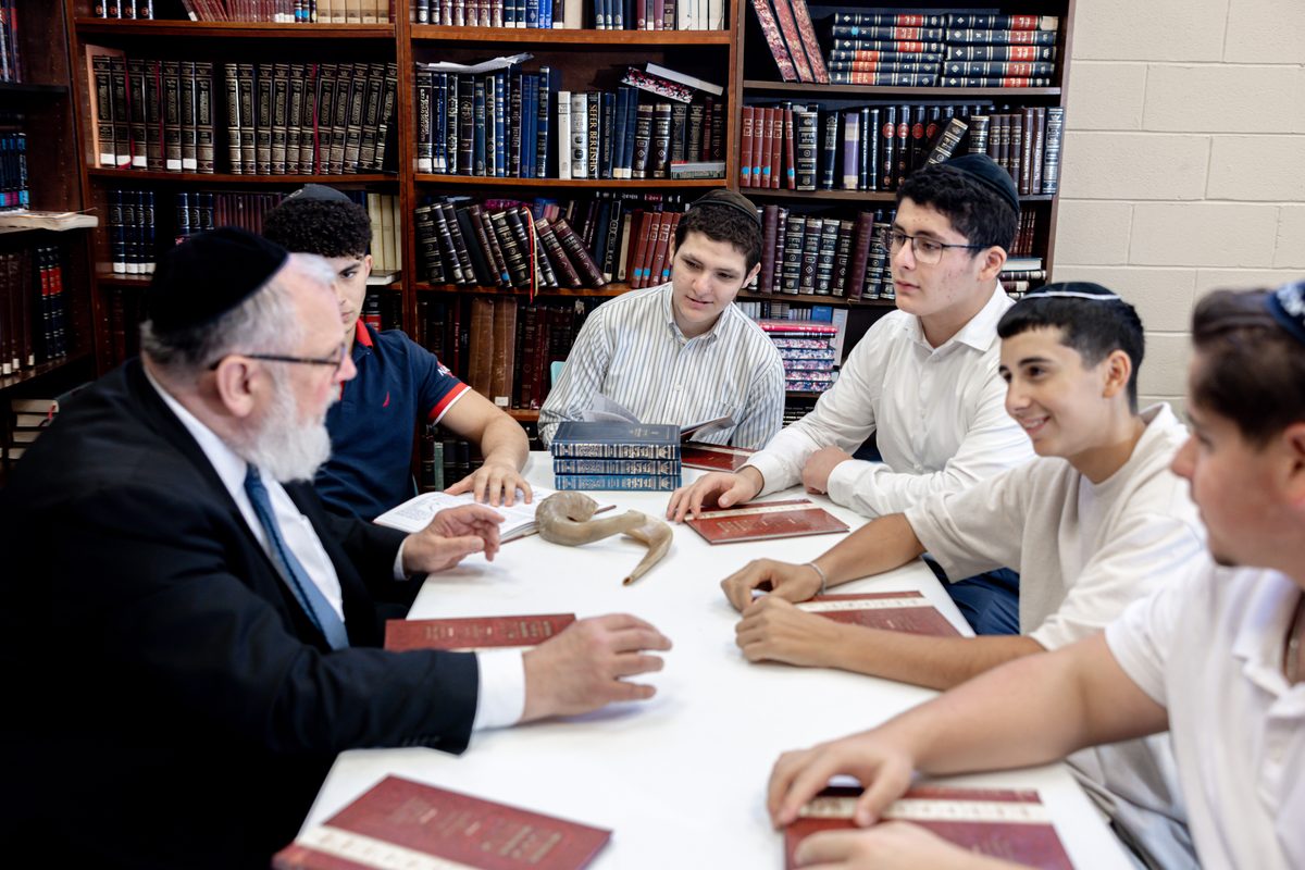 A rabbi learning with WHHS students